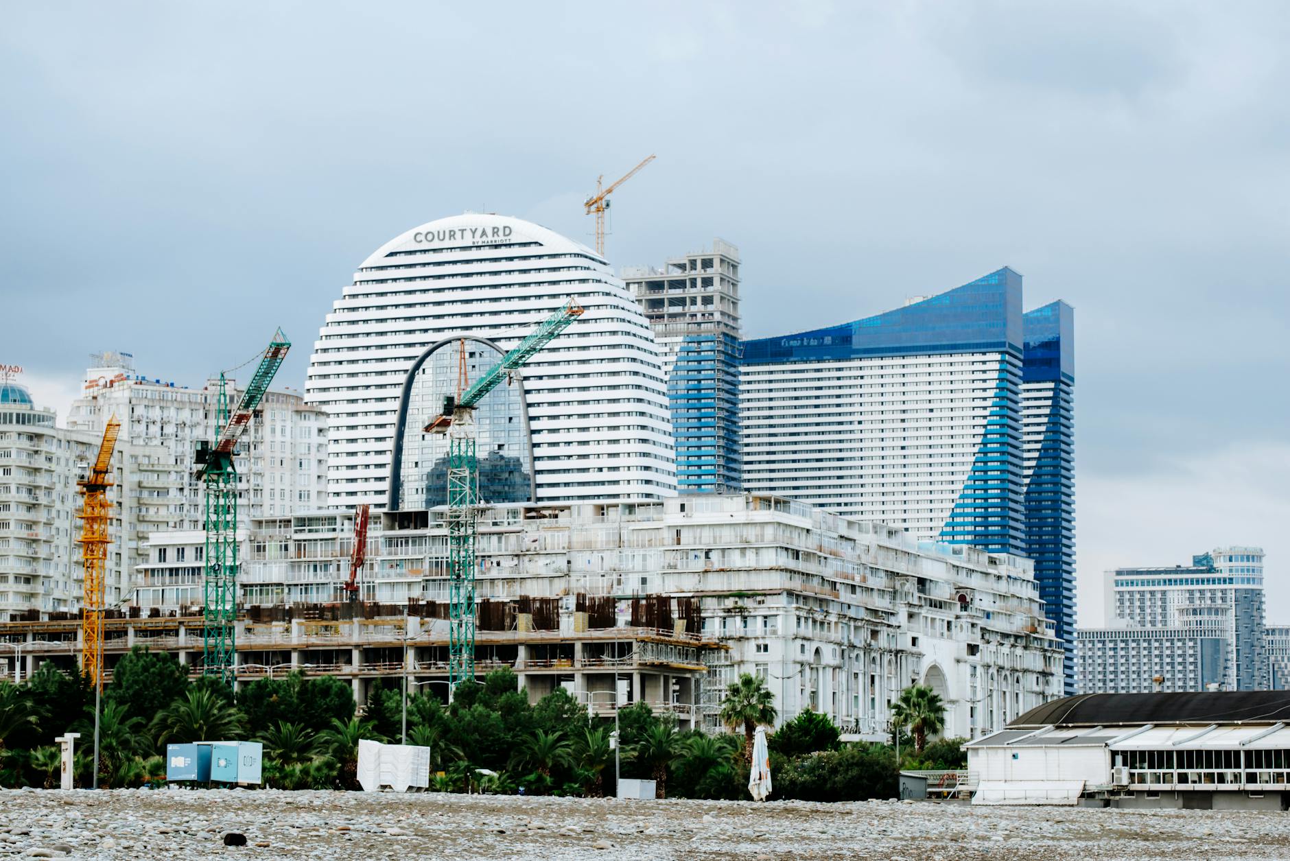 waterfront with a modern building under construction